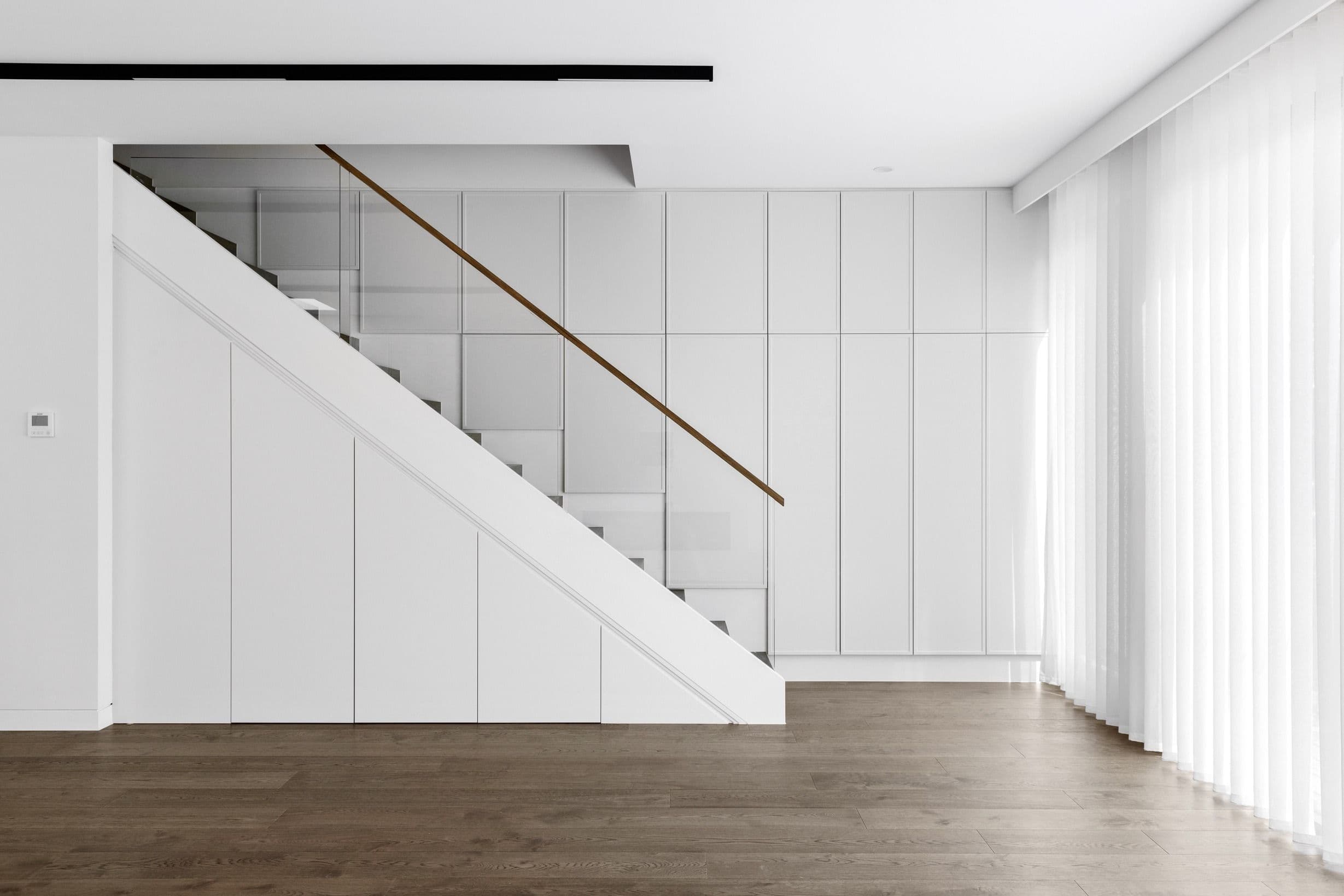 French Grey oak flooring across a Glen Iris living area and staircase.