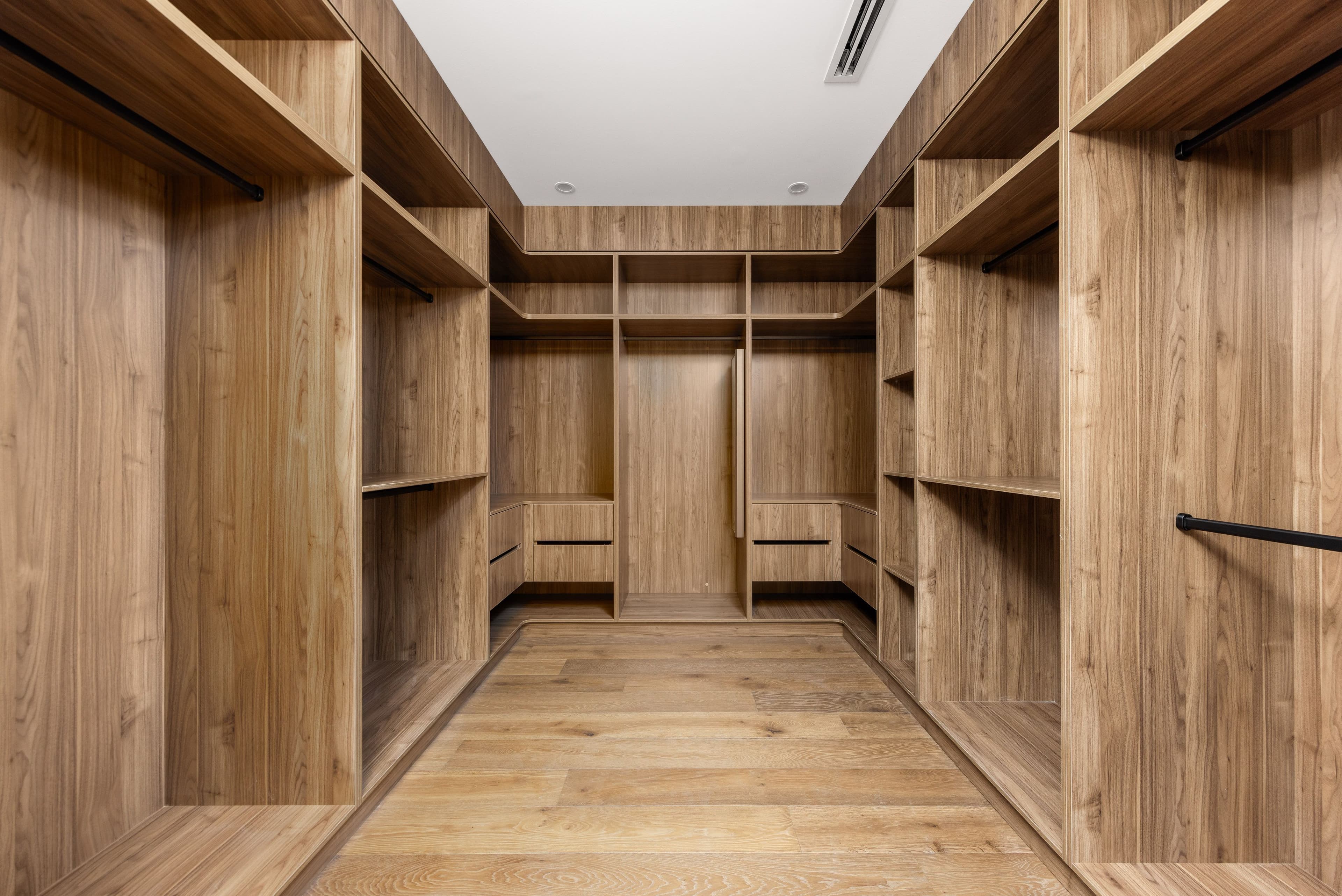 Smoked Brown oak flooring inside a timber-lined Balwyn walk-in wardrobe.