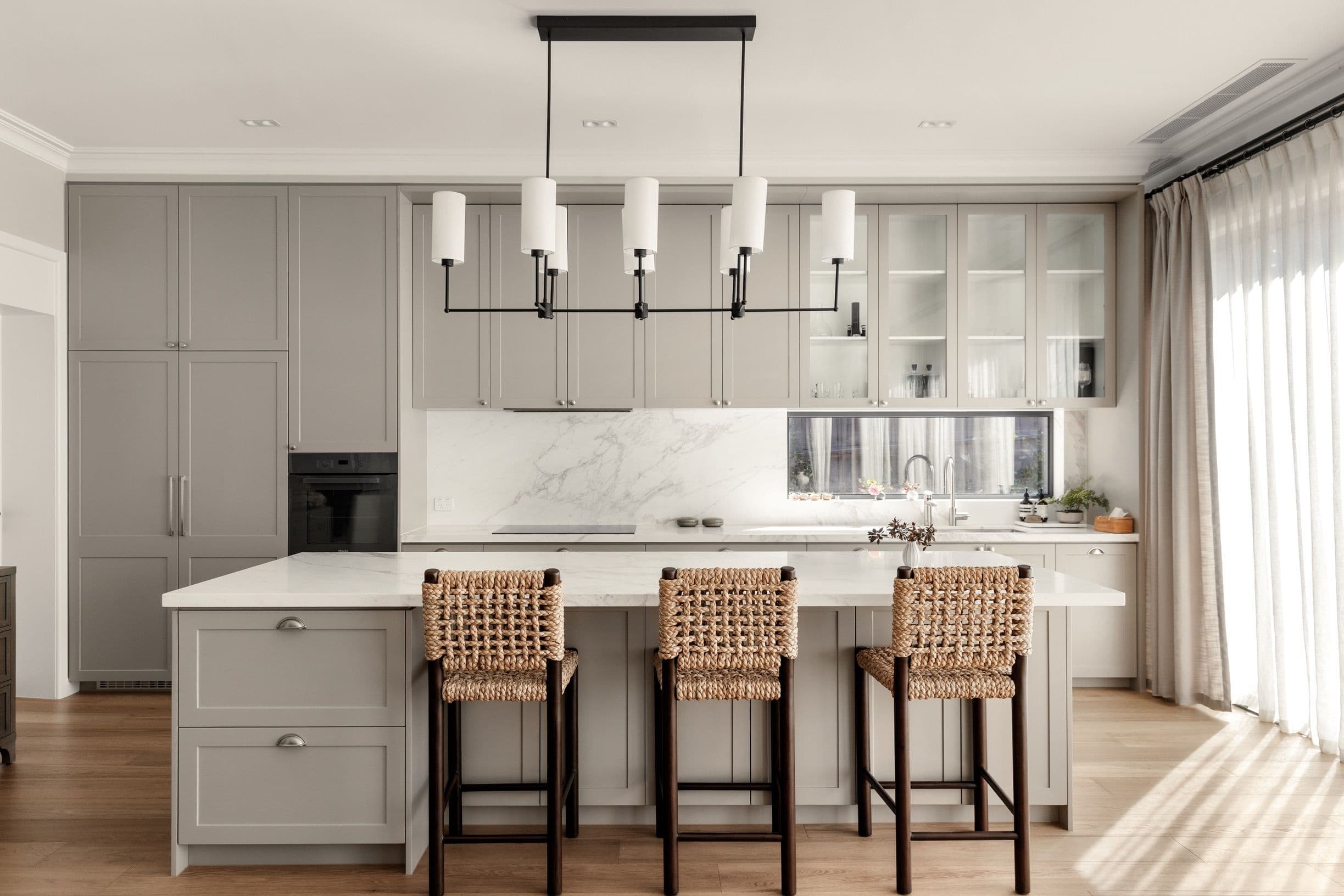 Chesterfield oak flooring around the kitchen island and cabinetry in Canterbury.