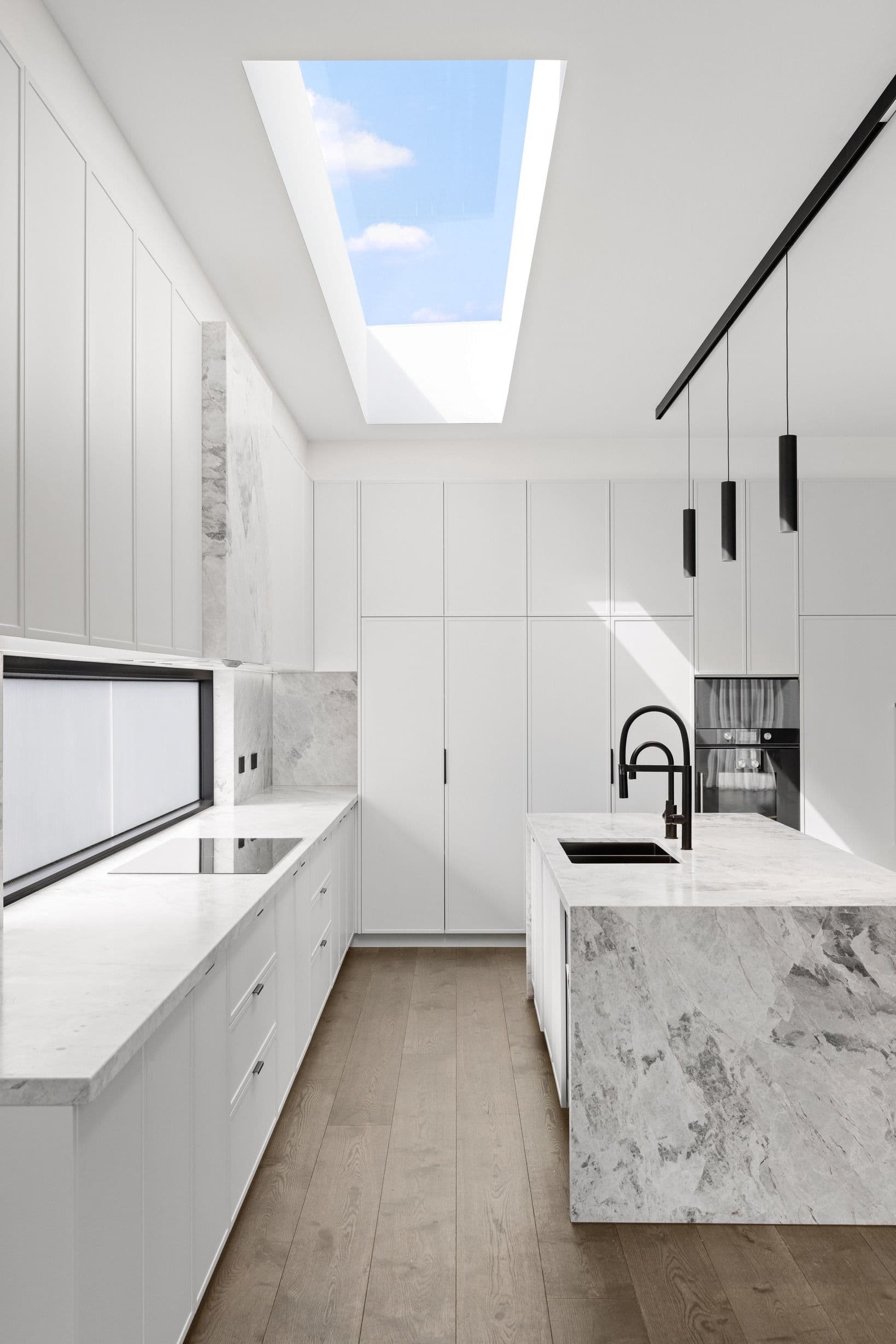 French Grey engineered oak flooring along a bright Glen Iris kitchen.
