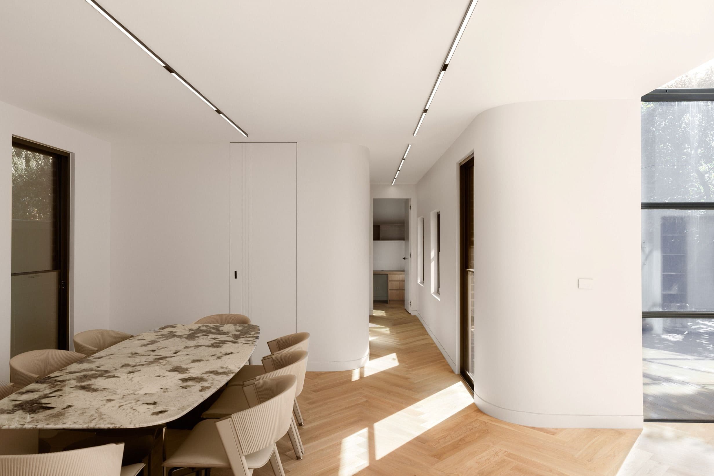 Natural Oak herringbone flooring beneath a dining setting in Kew.