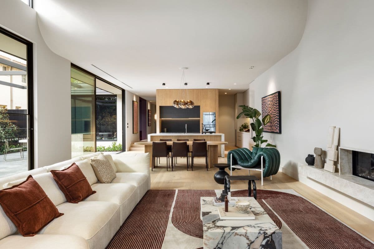 Avoca Bay oak flooring linking the living room and kitchen of a Kew home.