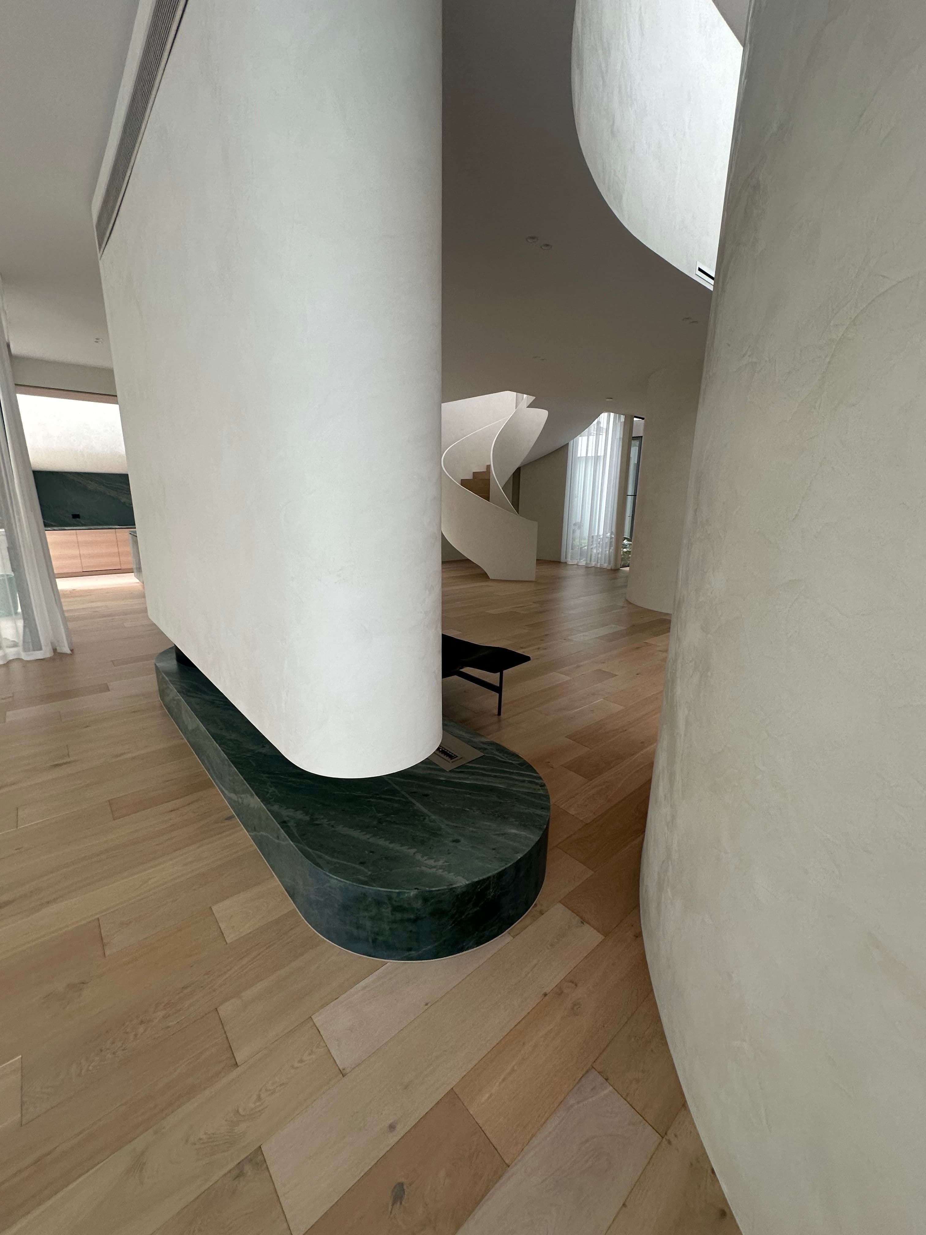 Cashmere flooring around curved walls and a feature column in Kew.