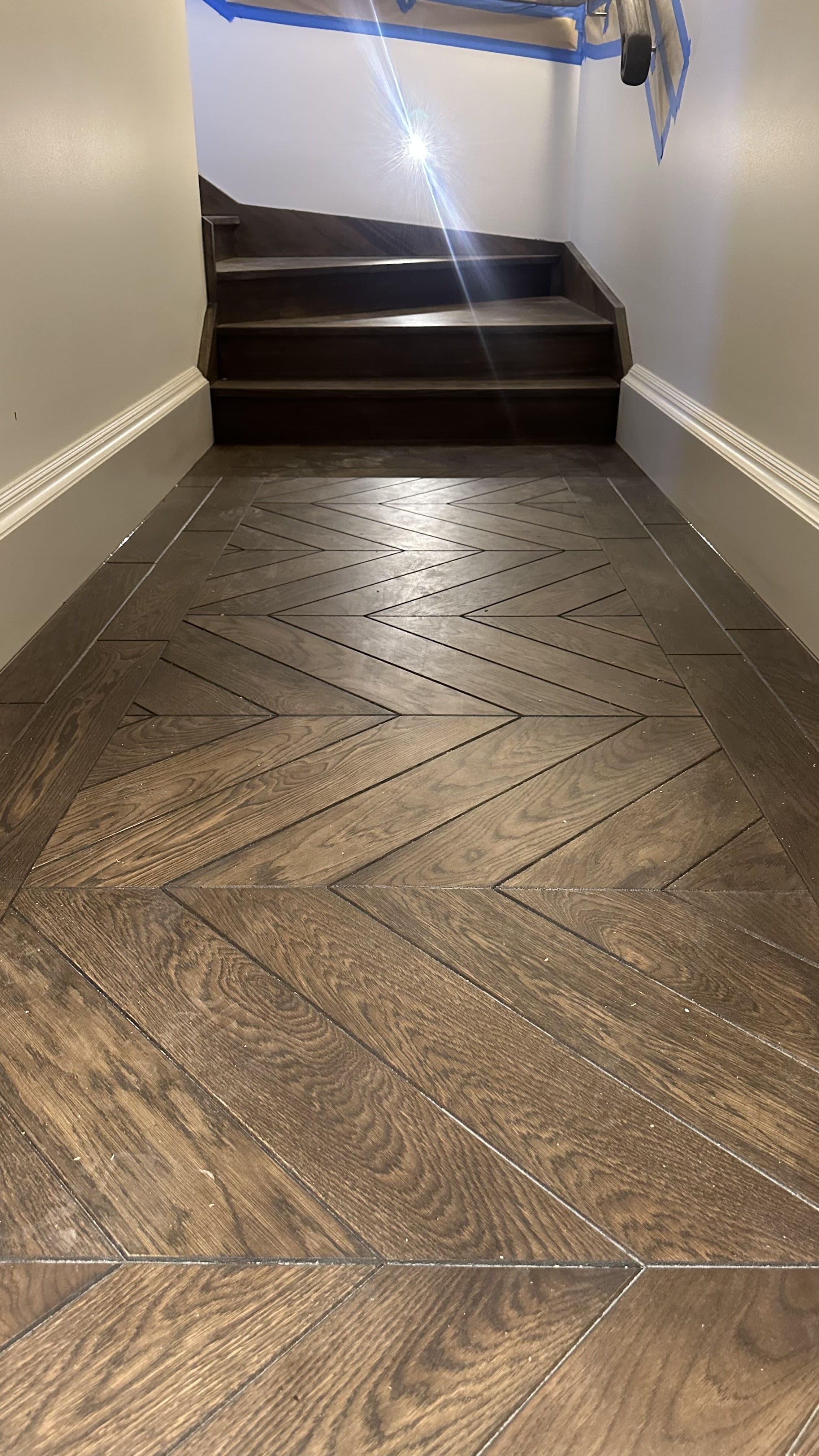 Solid oak chevron flooring in a small Balwyn North hallway.